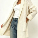Women’s plus size cardigan with front pockets.