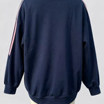 A navy blue crewneck sweatshirt with pink and white stripes down the sleeves, shown from the back on a mannequin against a light gray background.